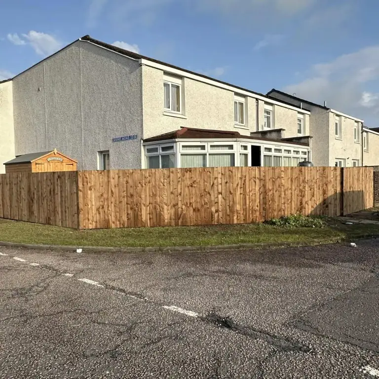 An open front garden, enclosed — after the work was completed